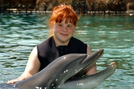Patricia with a dolphin at Discovery Cove, Orlando, FL